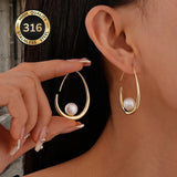 Orecchini a cerchio con perla crescent