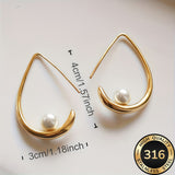 Orecchini a cerchio con perla crescent