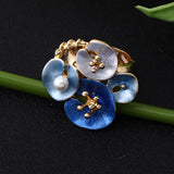 Anello dichiarativo regolabile in perle floreali blu
